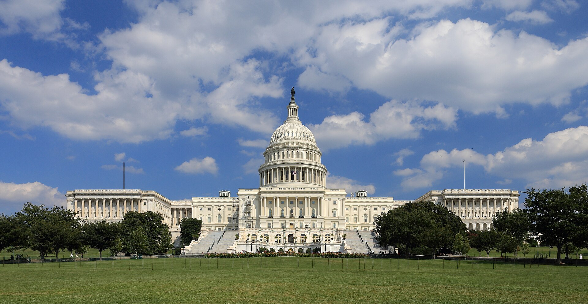 West front of the United States Capitol building under a blue sky