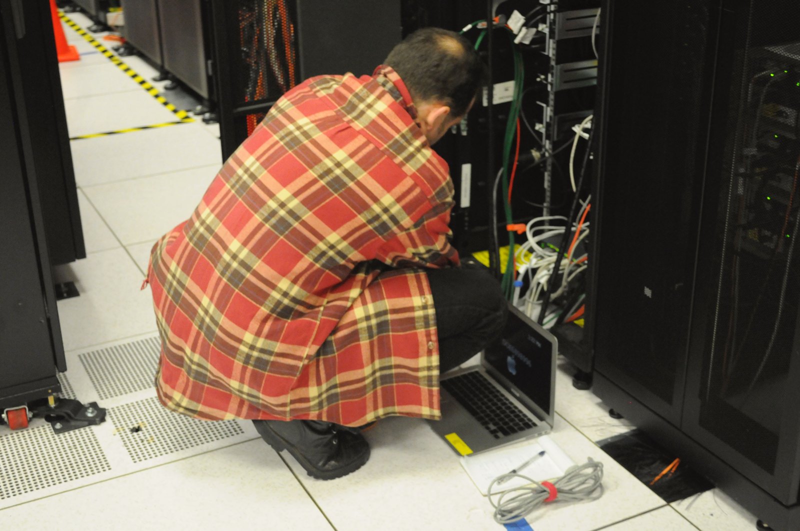 Data center server racks Rows of server racks inside a data center